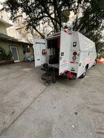 Magnet Plumbing service vehicle on-site for Grease Trap Cleaning in Watertown